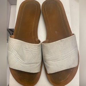 Well worn leather flats